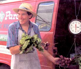 Farmer selling food at the farmers' market.